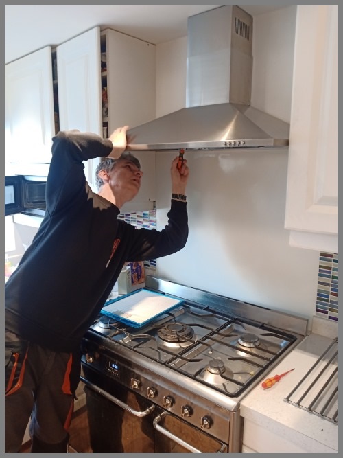 Kitchen hood installer in Peterborough working safely on commercial ventilation